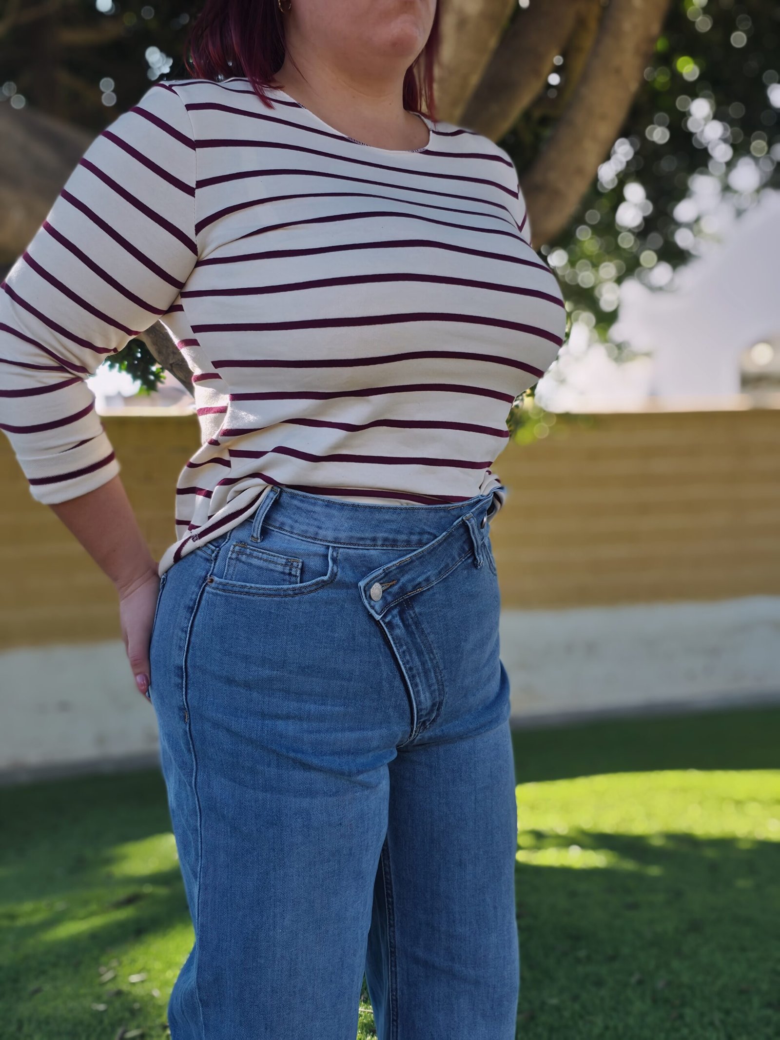 Vaquero palazo, cintura asimétrica, doble cierre